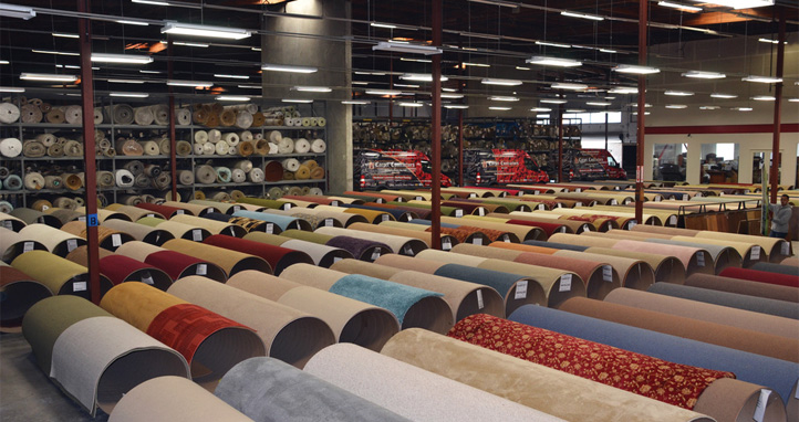 rolls of carpet in a mill warehouse